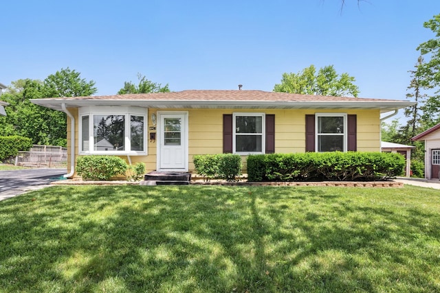 1724 Sycamore Ave, Hanover Park, IL 60133 - view of front of house featuring a front lawn and roof with shingles