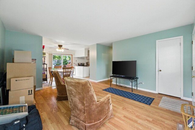 1724 Sycamore Ave, Hanover Park, IL 60133 - living room featuring light wood-style floors and ceiling fan