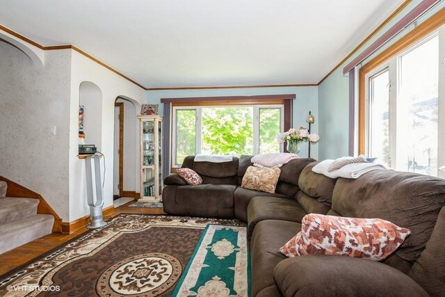 9230 S Saint Louis Ave, Evergreen Park, IL 60805 - living area with arched walkways, crown molding, wood finished floors, baseboards, and stairs