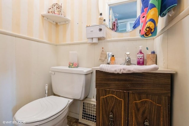 9230 S Saint Louis Ave, Evergreen Park, IL 60805 - bathroom featuring toilet, wallpapered walls, vanity, and wainscoting