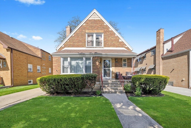 9656 S Utica Ave, Evergreen Park, IL 60805 - view of front of property featuring a porch, a front lawn, and brick siding