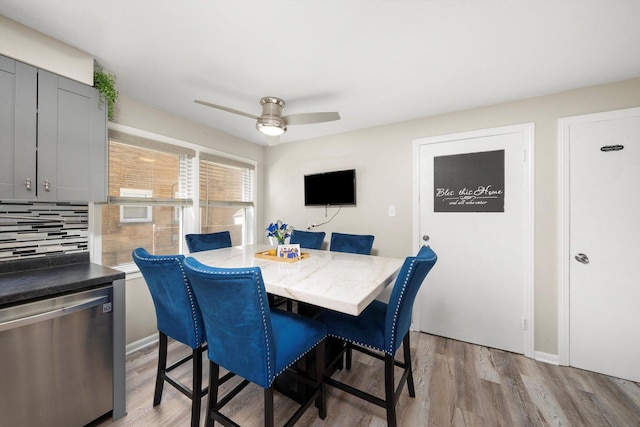 9656 S Utica Ave, Evergreen Park, IL 60805 - dining room with light wood-style floors, ceiling fan, and baseboards