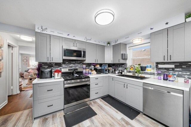 9656 S Utica Ave, Evergreen Park, IL 60805 - kitchen with stainless steel appliances, gray cabinets, and a sink