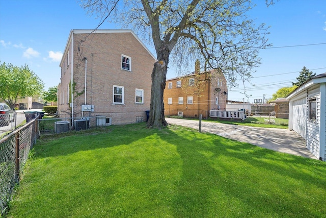 9656 S Utica Ave, Evergreen Park, IL 60805 - rear view of house with central AC and a patio area