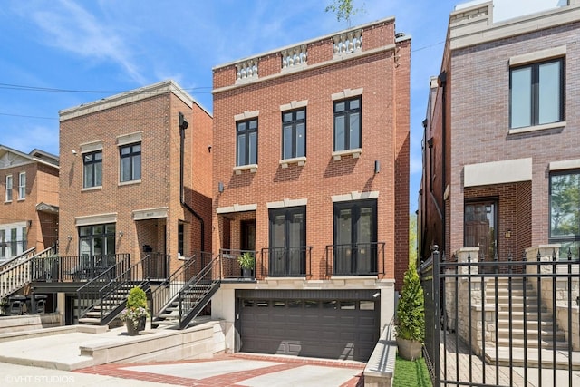 multi unit property with brick siding, an attached garage, and concrete driveway