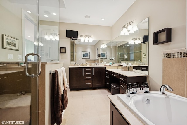 bathroom featuring a shower stall, vanity, and a bath