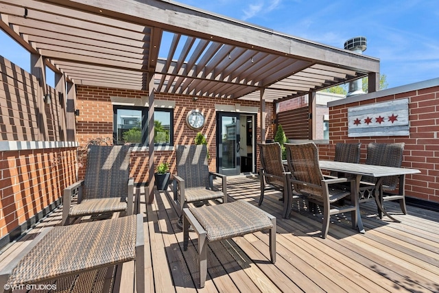 wooden terrace with a pergola and outdoor dining area