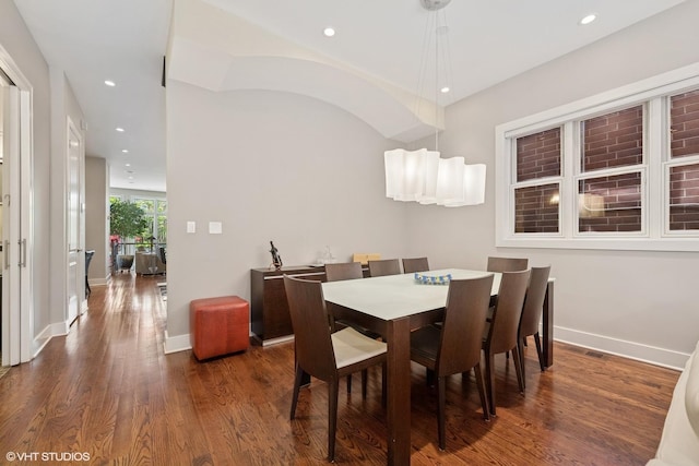 dining area featuring wood finished floors, baseboards, and recessed lighting