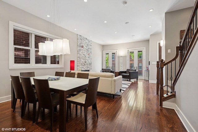 dining room with stairway, dark wood finished floors, baseboards, recessed lighting, and french doors