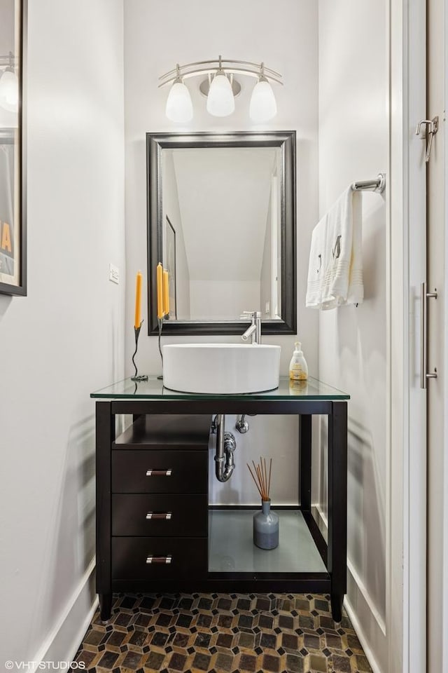 bathroom with baseboards and vanity