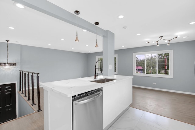 18008 Crawford Ave, Country Club Hills, IL 60478 - kitchen featuring stainless steel dishwasher, a sink, light stone counters, hanging light fixtures, and open floor plan