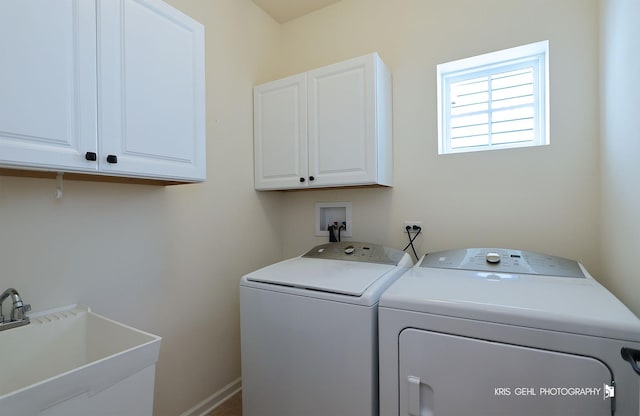 1400 Colchester Ln, Aurora, IL 60505 - laundry room featuring washer and dryer, cabinet space, and baseboards