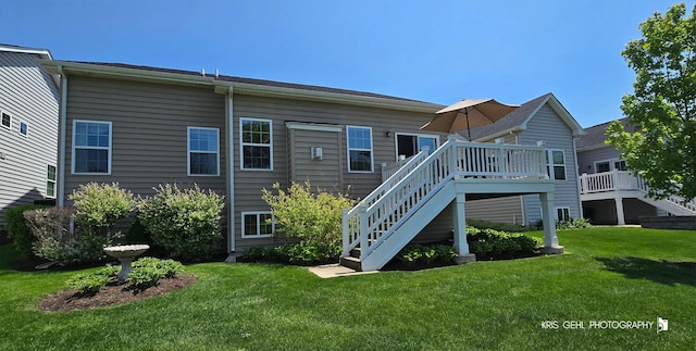1400 Colchester Ln, Aurora, IL 60505 - back of house featuring a lawn, a deck, and stairs