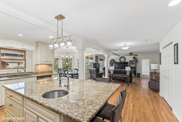 506 Rodney St, Lockport, IL 60441 - kitchen featuring decorative columns, a sink, a ceiling fan, light wood-style floors, and recessed lighting