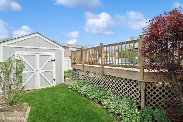 506 Rodney St, Lockport, IL 60441 - view of grassy yard featuring a storage unit, a wooden deck, and an outbuilding