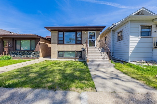 7426 W 64th St, Summit, IL 60501 - view of front facade featuring brick siding and a front lawn