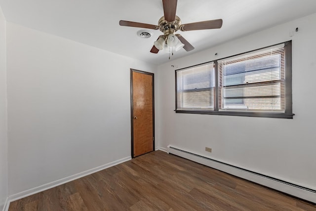 7426 W 64th St, Summit, IL 60501 - unfurnished room featuring a baseboard radiator, wood finished floors, ceiling fan, and baseboards