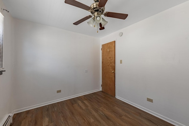 7426 W 64th St, Summit, IL 60501 - unfurnished room featuring a baseboard radiator, wood finished floors, ceiling fan, and baseboards