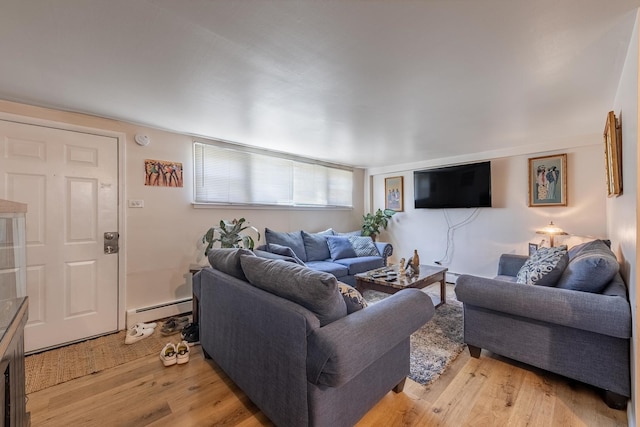 7426 W 64th St, Summit, IL 60501 - living area featuring a baseboard radiator and light wood-style floors