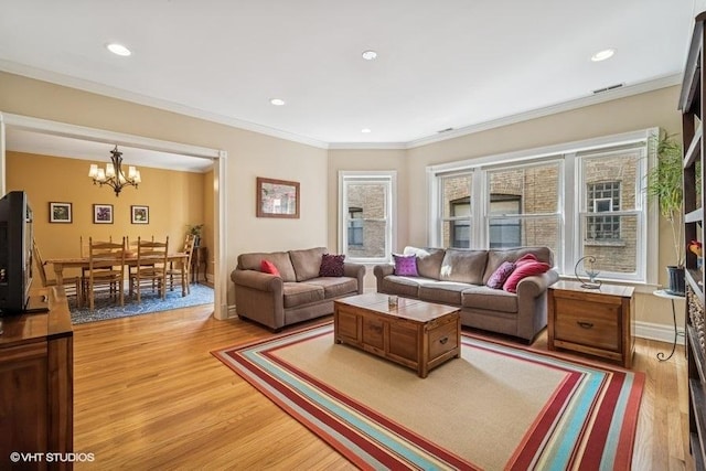 4444 N Wolcott Ave Unit 2A, Chicago, IL 60640 - living area with healthy amount of natural light, light wood finished floors, a chandelier, recessed lighting, and ornamental molding