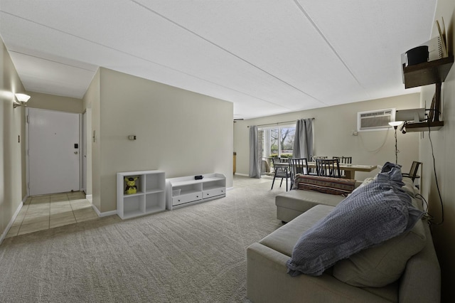 living room with carpet flooring, an AC wall unit, and baseboards