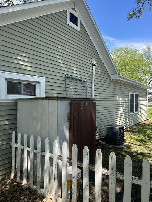 833 S 5th Ave, Kankakee, IL 60901 - view of property exterior featuring central AC