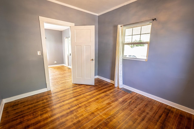 684 S Gordon Ave, Kankakee, IL 60901 - empty room with ornamental molding, baseboards, and wood finished floors