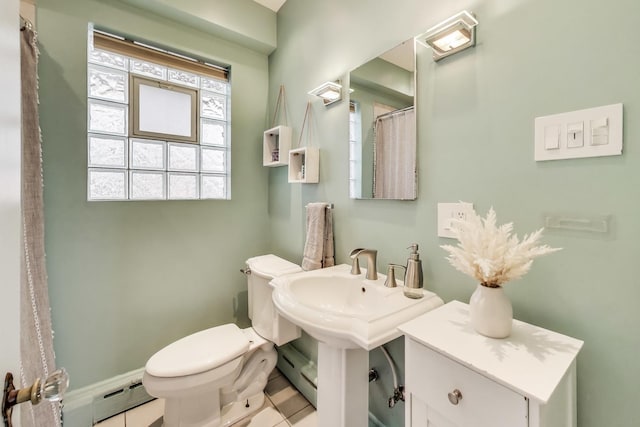 6167 N Naper Ave, Chicago, IL 60631 - bathroom with a baseboard radiator, toilet, a baseboard heating unit, tile patterned floors, and baseboards