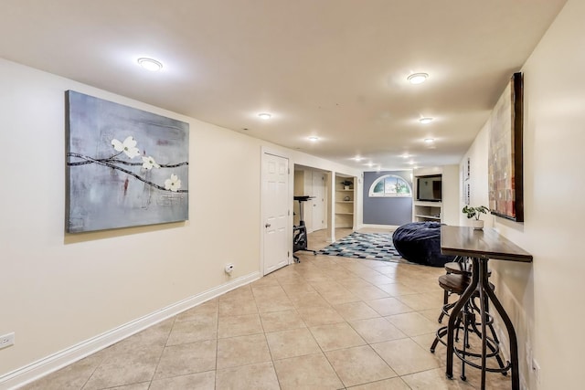 6167 N Naper Ave, Chicago, IL 60631 - hallway featuring light tile patterned flooring, built in shelves, and baseboards