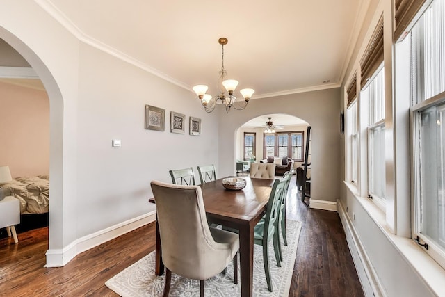 6167 N Naper Ave, Chicago, IL 60631 - dining area featuring ceiling fan, crown molding, arched walkways, a chandelier, and dark wood-type flooring