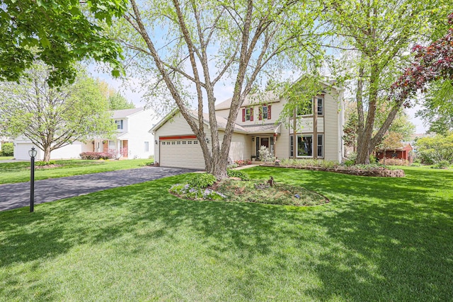 43 Mohawk St, Cary, IL 60013 - traditional home featuring driveway, a front yard, and an attached garage