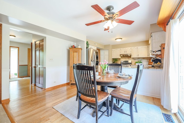 43 Mohawk St, Cary, IL 60013 - dining space featuring light wood-type flooring, a ceiling fan, and baseboards