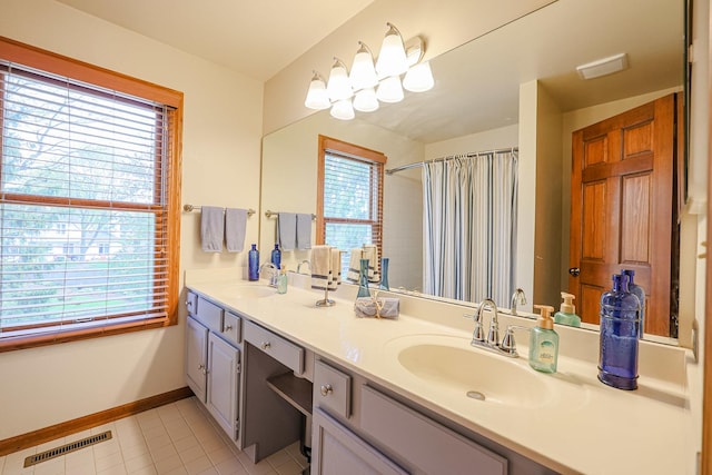 43 Mohawk St, Cary, IL 60013 - bathroom featuring baseboards, double vanity, tile patterned floors, and a shower with curtain