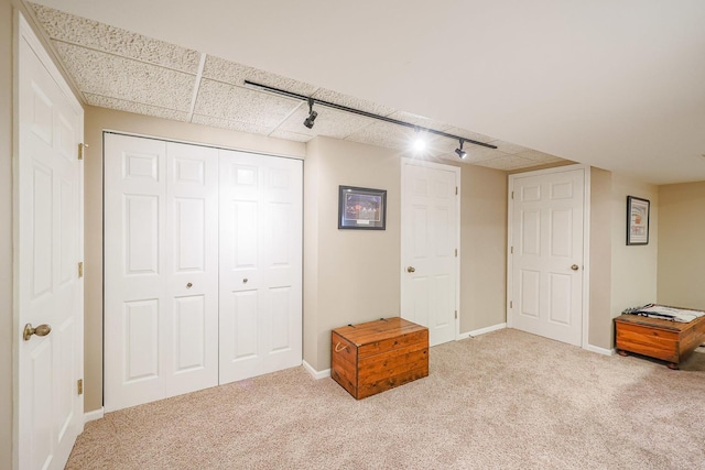 43 Mohawk St, Cary, IL 60013 - bedroom featuring rail lighting, carpet floors, a closet, and baseboards
