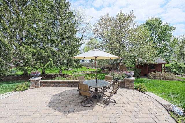43 Mohawk St, Cary, IL 60013 - view of patio / terrace featuring outdoor dining space and an outbuilding