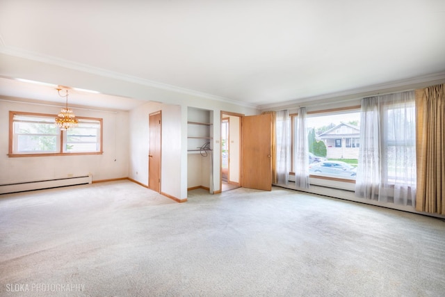 unfurnished living room with carpet flooring, a chandelier, ornamental molding, baseboards, and baseboard heating