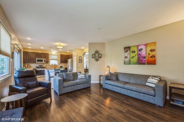 2140 Colchester Ave, Hoffman Estates, IL 60192 - living area featuring dark wood-style flooring, arched walkways, baseboards, and recessed lighting