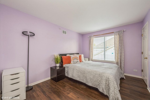 2140 Colchester Ave, Hoffman Estates, IL 60192 - bedroom with dark wood finished floors and baseboards