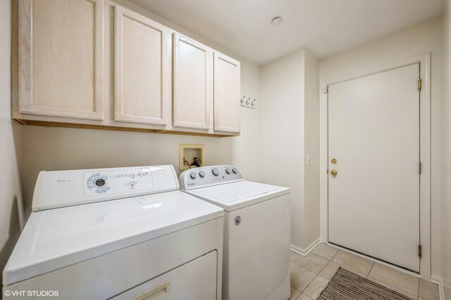 2140 Colchester Ave, Hoffman Estates, IL 60192 - laundry area with washer and dryer, cabinet space, light tile patterned floors, and baseboards