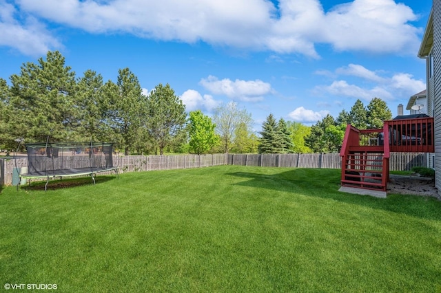 2140 Colchester Ave, Hoffman Estates, IL 60192 - view of yard with a trampoline, stairway, and a deck