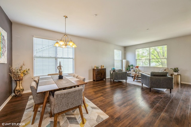 2140 Colchester Ave, Hoffman Estates, IL 60192 - dining space with wood finished floors, a chandelier, and baseboards