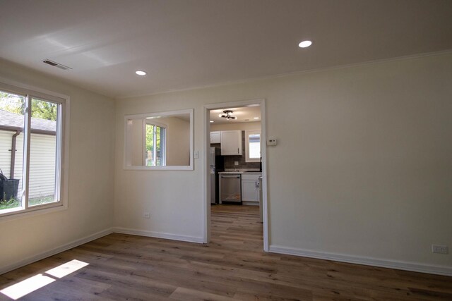 239 Marquette St, Park Forest, IL 60466 - unfurnished room featuring healthy amount of natural light, wood finished floors, baseboards, recessed lighting, and crown molding