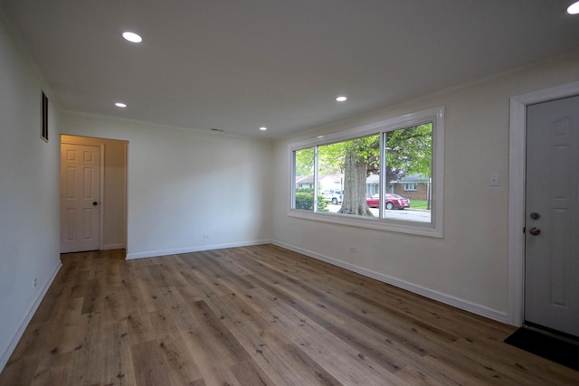 239 Marquette St, Park Forest, IL 60466 - empty room with wood finished floors, baseboards, recessed lighting, and crown molding