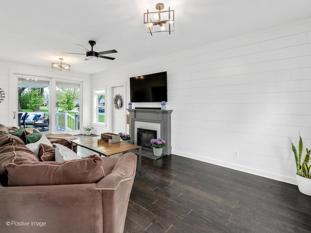 733 S Naperville Rd, Wheaton, IL 60189 - living room with baseboards, a fireplace, a chandelier, dark wood-type flooring, and ceiling fan