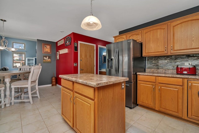 203 Jefferson St, Manteno, IL 60950 - kitchen featuring stainless steel refrigerator with ice dispenser, a center island, backsplash, and light tile patterned floors