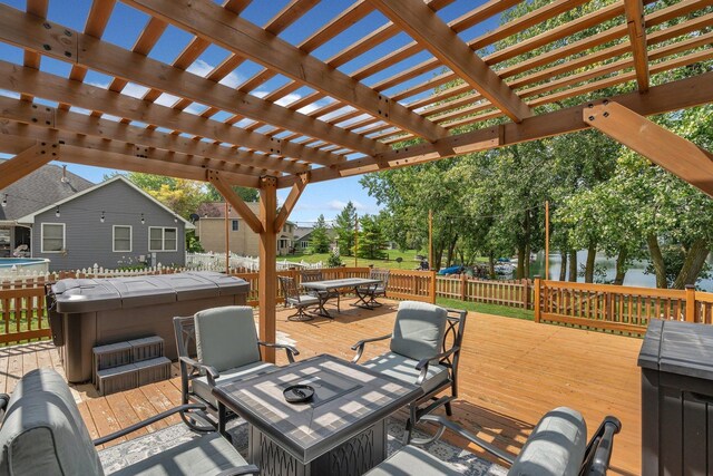 203 Jefferson St, Manteno, IL 60950 - deck with a hot tub, outdoor dining area, a fire pit, and a water view