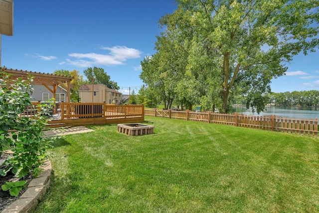 203 Jefferson St, Manteno, IL 60950 - view of yard featuring a deck with water view