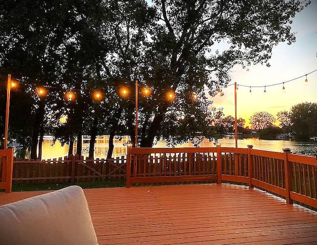 203 Jefferson St, Manteno, IL 60950 - deck at dusk featuring a water view