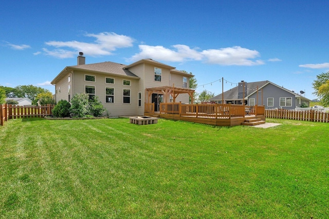 203 Jefferson St, Manteno, IL 60950 - rear view of house with a deck, a fire pit, a pergola, and a chimney