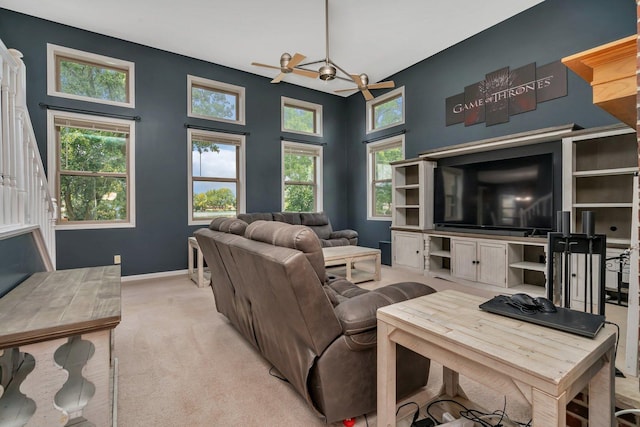 203 Jefferson St, Manteno, IL 60950 - living area featuring baseboards, light carpet, and healthy amount of natural light